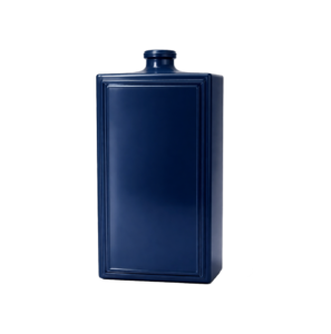 Navy blue glass bottle on white backdrop